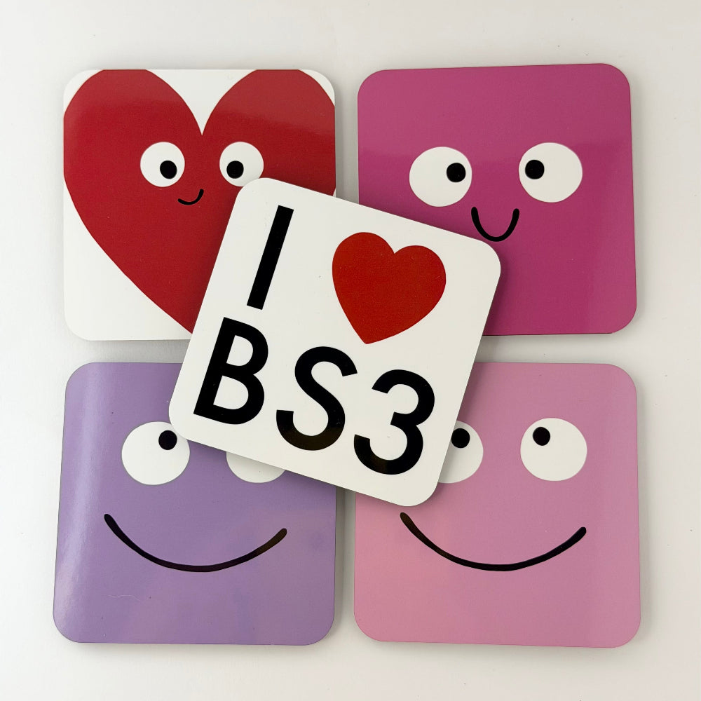 Four colorful coasters with cartoon faces and a central coaster with 'I ❤️ BS3' text on a white background.